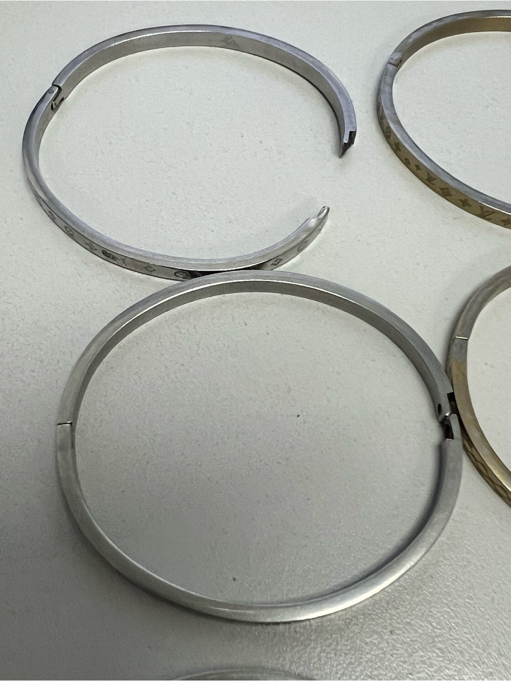 Chanel, LV, Gucci Stackable Silver and Gold Logo Bangle Set - Picture 14 of 16